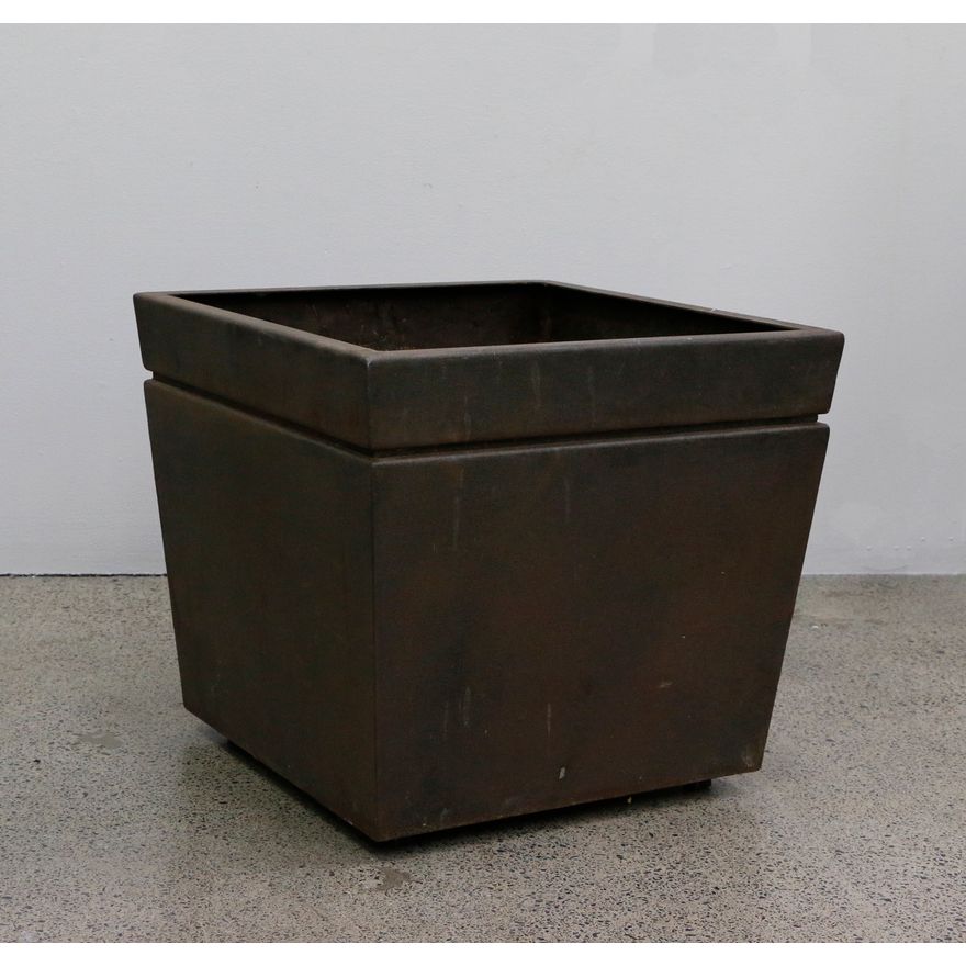 A pair of smaller metal planters