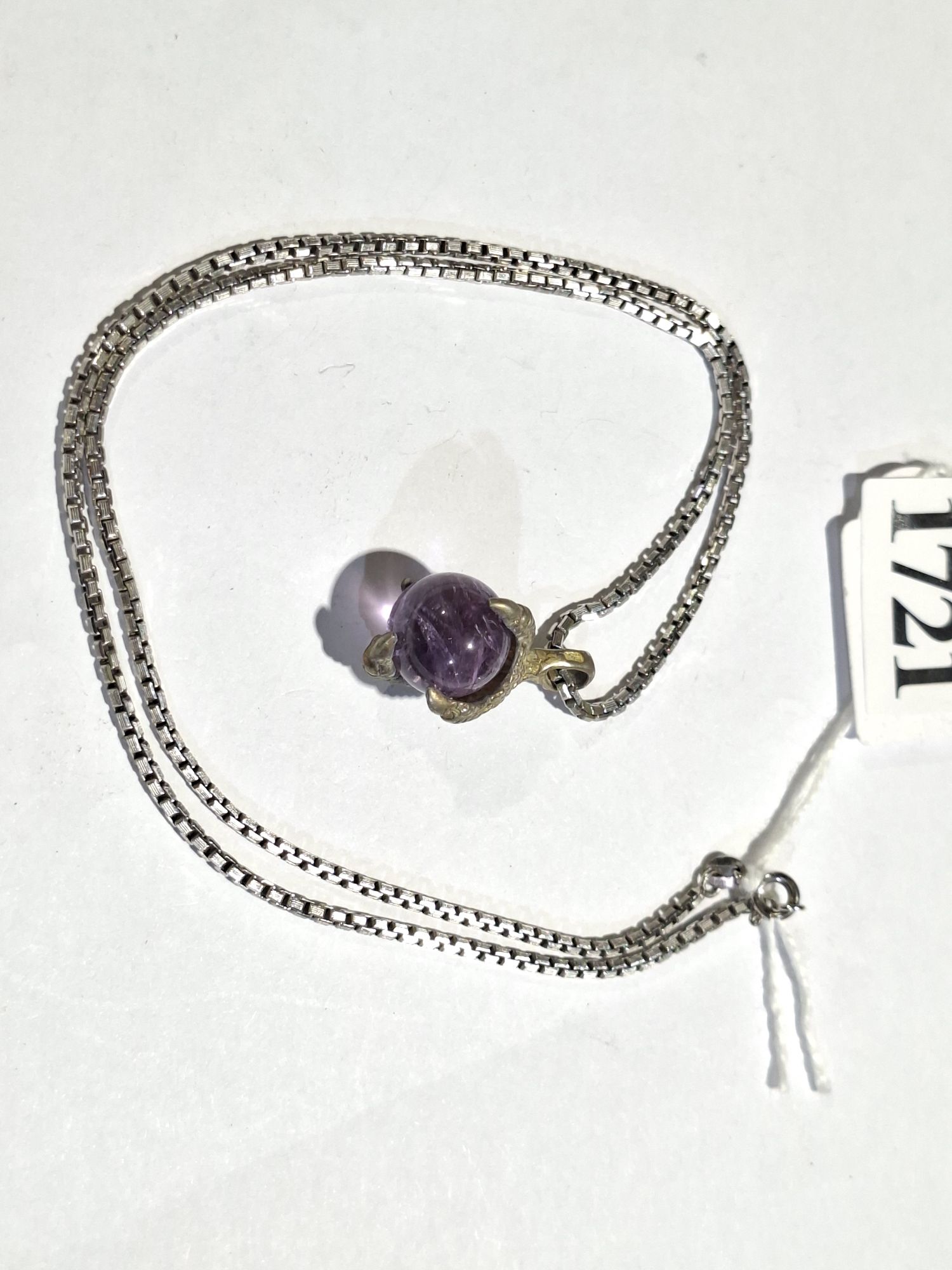 Silver And Amethyst Claw Pendant