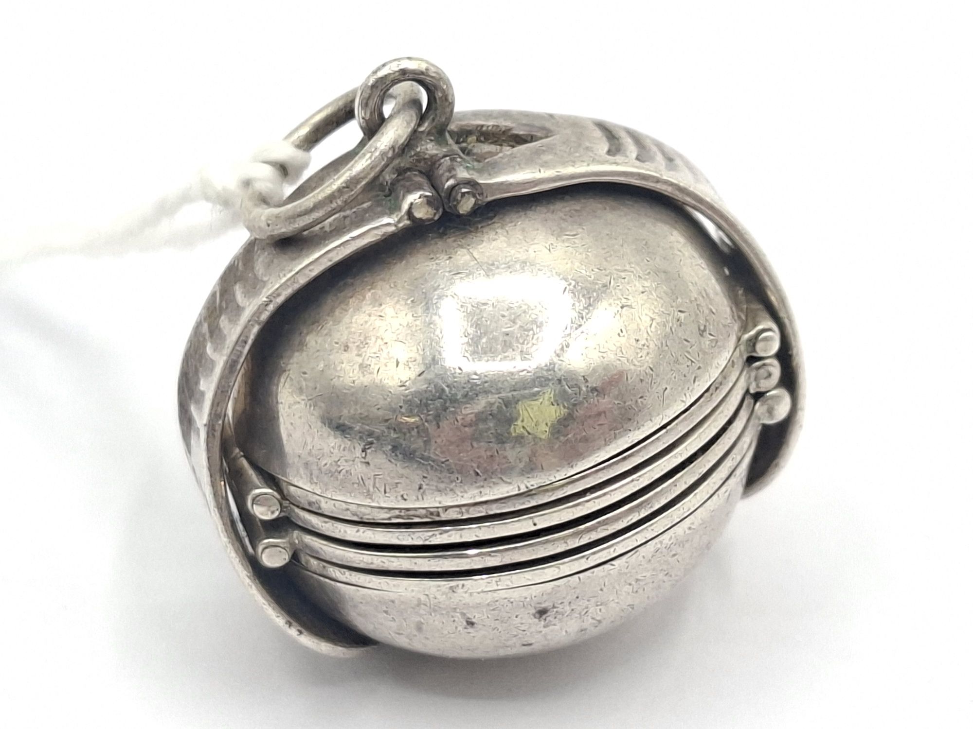 1033 · STERLING SILVER FOLDING BALL LOCKET PENDANT