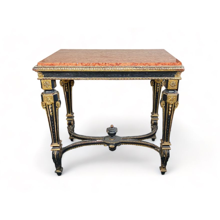 A 19th century French ebonised and parcel gilt centre table in the Louis XIV style