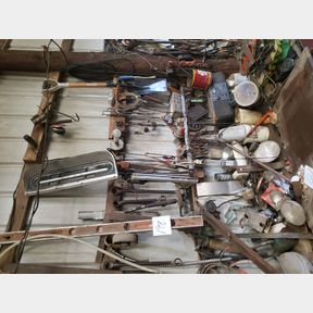 East wall behind parts washer, old end wrenches