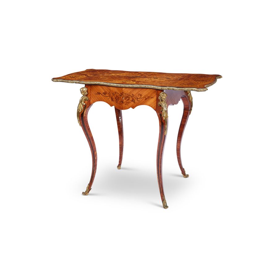 A Napoleon III kingwood, tulipwood marquetry table Ã  milieu applied with gilt bronze mounts