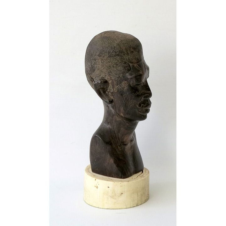 AFRICAN CARVED EBONY BUST ON IVORY STAND