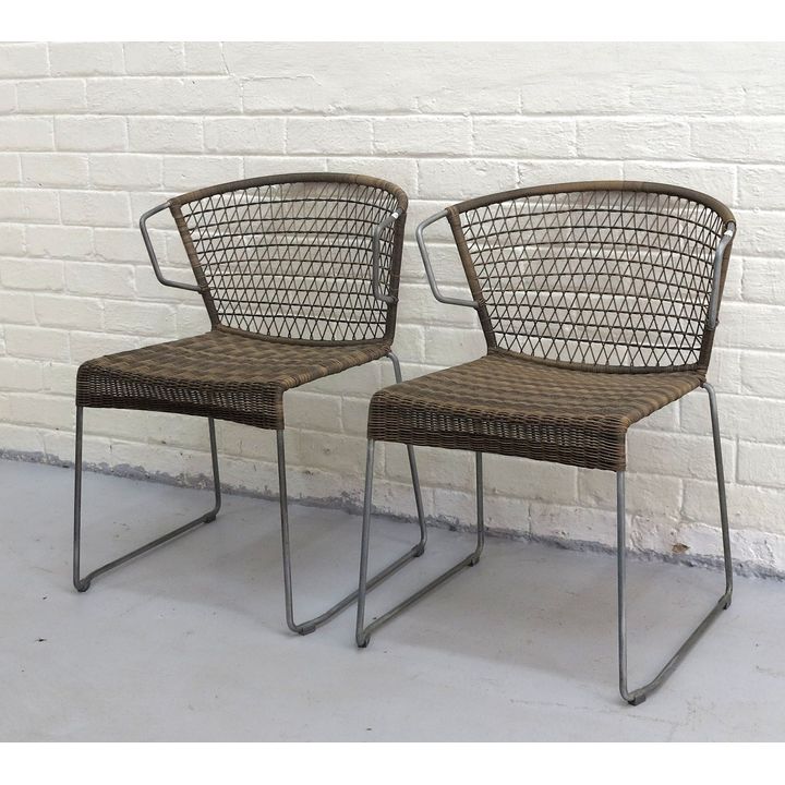 PAIR OF RATTAN UPHOLSTERED METAL GARDEN CHAIRS, after a design by Hannes Wettstein