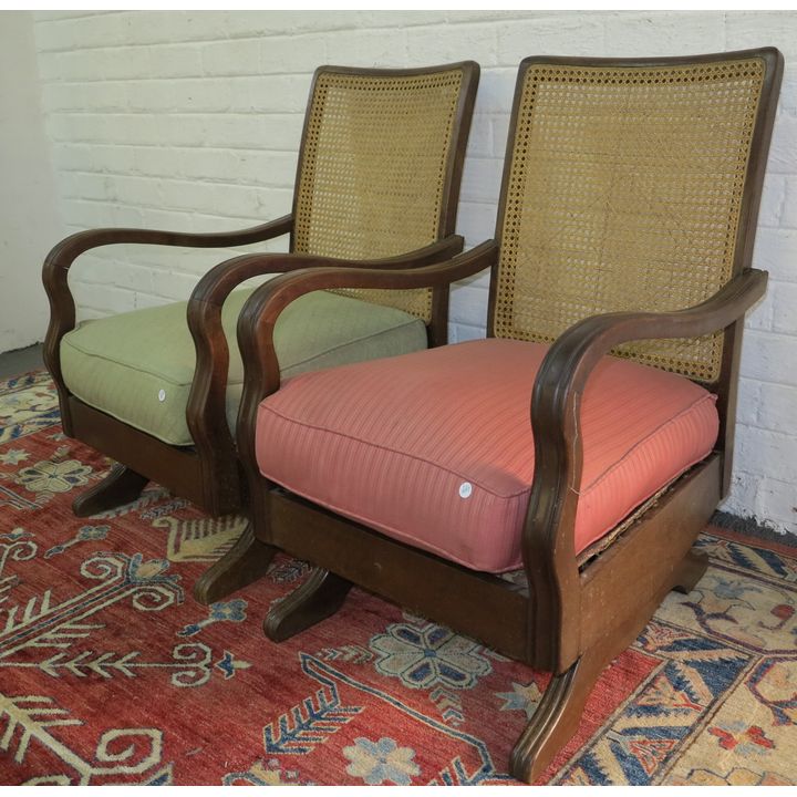 PAIR OF UPHOLSTERED ROCKING CHAIRS,