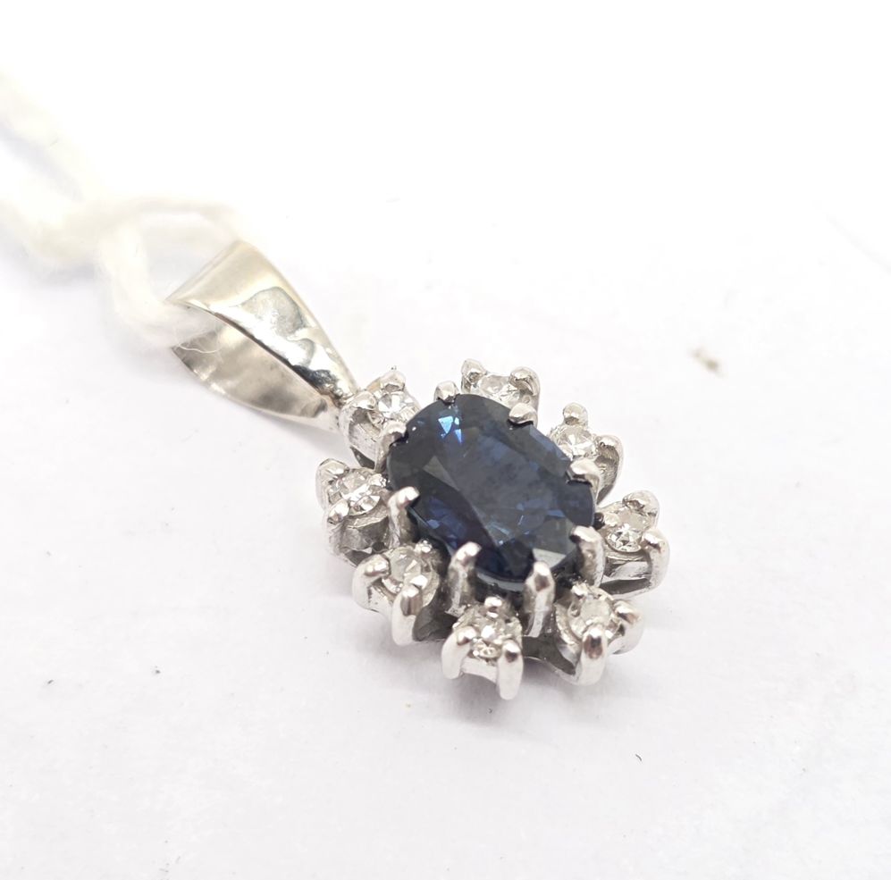 118 · 18CT SAPPHIRE AND DIAMOND PENDANT