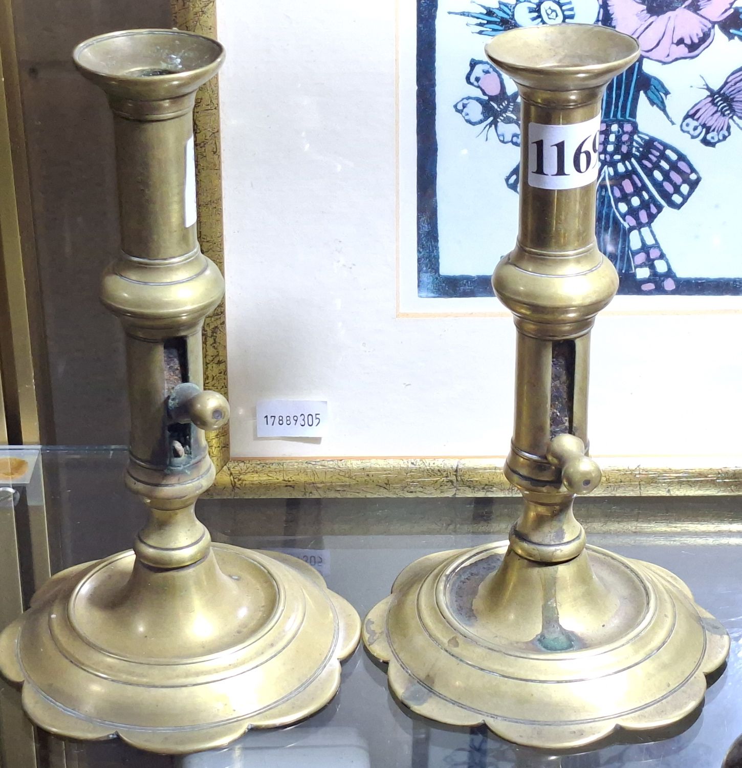 1169 · A PAIR OF ANTIQUE CANDLESTICKS