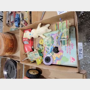 Various cardboard NASA toys and Pillsbury squeeze toy