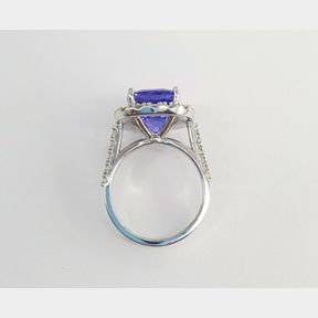 TANZANITE AND DIAMOND RING 6.916CT EGL CERTIFIED BLUE VIOLET WITH A LIGHTLY INCLUDED PURITY SET IN WHITE GOLD RING