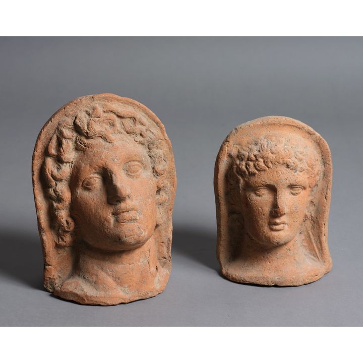 Two terracotta heads in the Roman style