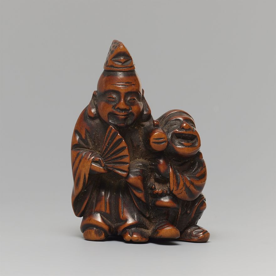 A boxwood netsuke of Ebisu and Daikoku. 19th century