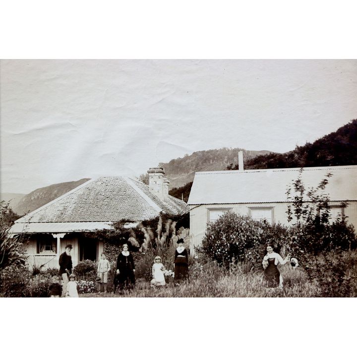 SPENCER, CHARLES [2 images] - The Haszard family in their garden outside their home in Te Wairoa