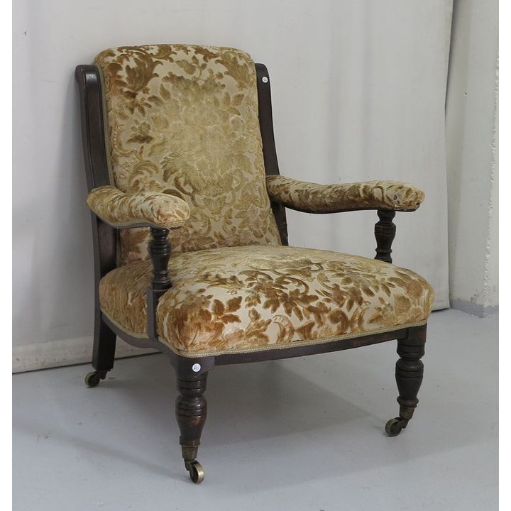 UPHOLSTERED ARMCHAIR ON CASTORS