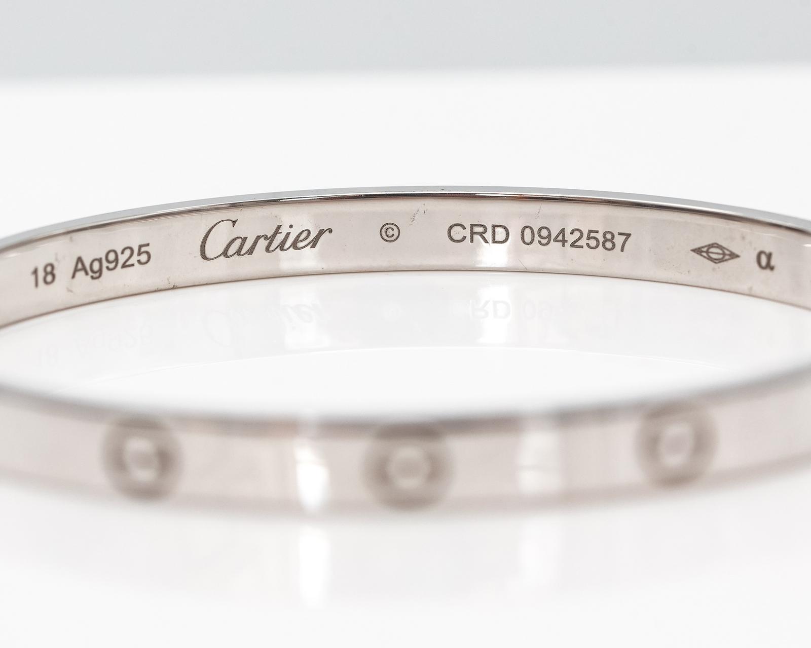CARTIER Style silver hinge bangle | OldJW Auctioneers