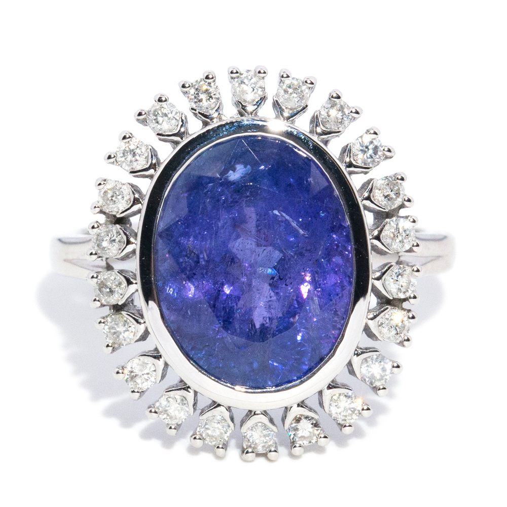 84 · 5.85 Carat Tanzanite & Diamond Halo Ring in 14ct Gold