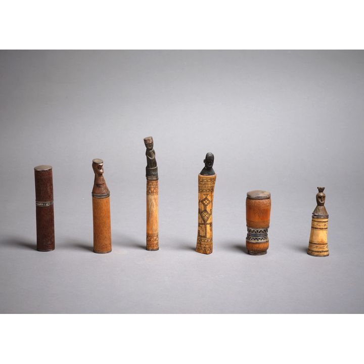 A collection of six tribal betel nut habit lime containers