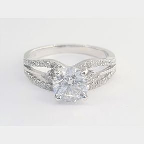 1.067 FINEST WHITE EGL CERTIFIED DIAMOND RING SET IN A 18CT WHITE GOLD DRESS RING WITH 38 ROUND BRILLIAND CUT DIAMONDS