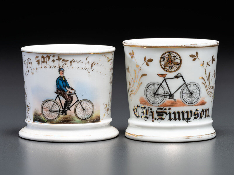 Two Cyclist's Porcelain Shaving Mugs