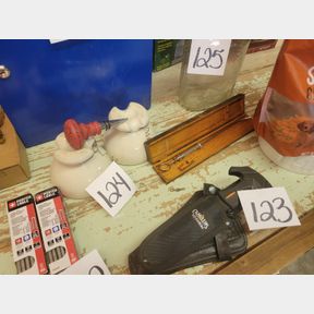 Vintage insulators, wine stopper, and antique medical tool