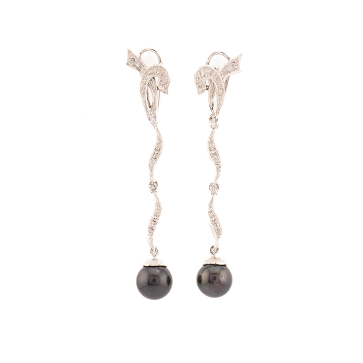 Aretes largos con perla