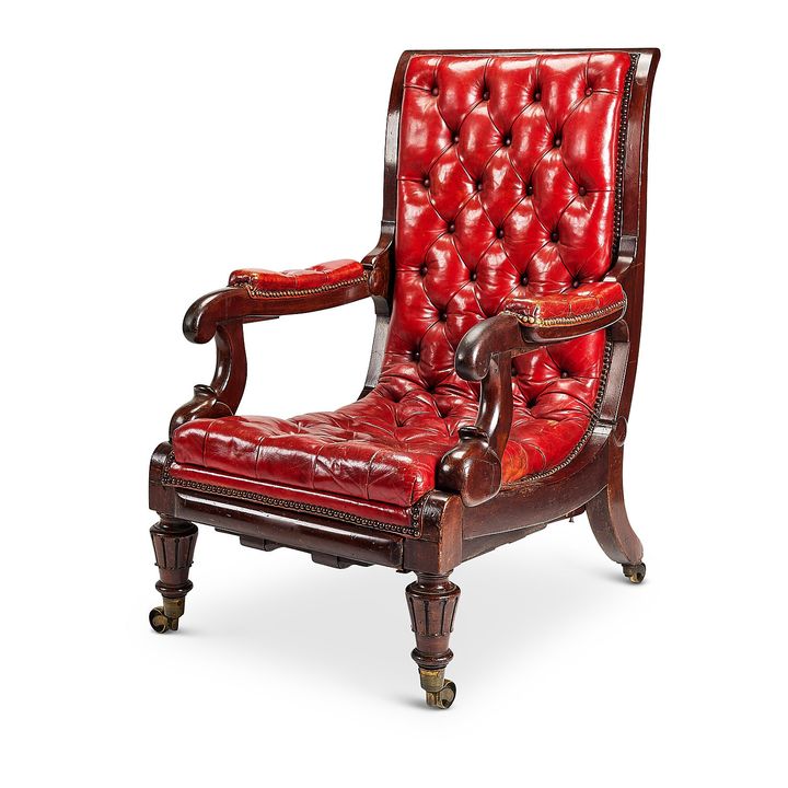 A George IV mahogany red leather patent reclining library armchair by Robert Daws