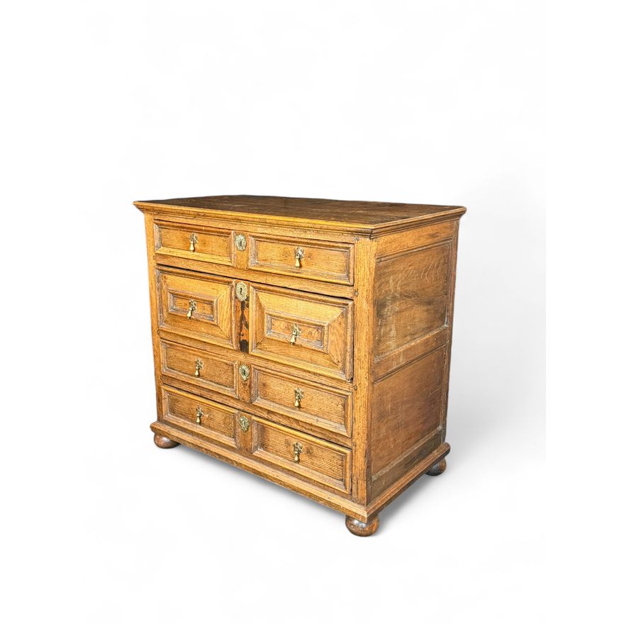 A Charles II oak moulded chest
