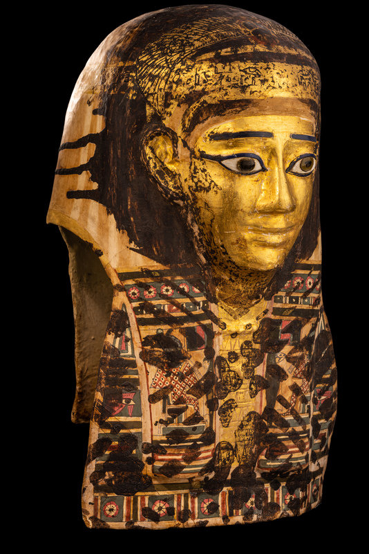 An Egyptian Gilt Cartonnage Mummy Mask
Height 18 1/2 inches (47 cm).