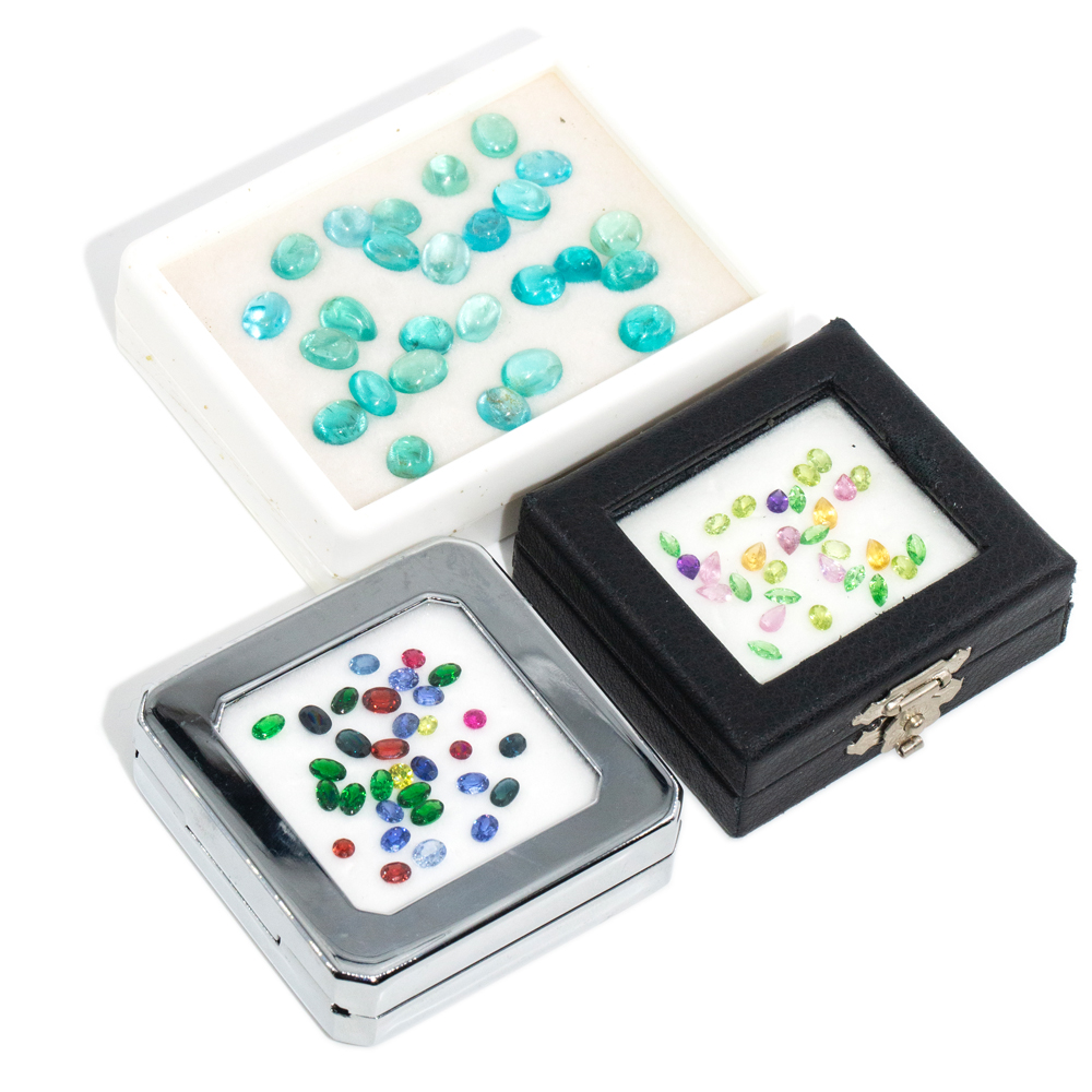 191 · 53+ Carat Three-Case Parcel of Mixed Loose Gemstones: Apatite, Sapphire, Garnet & More