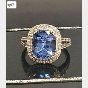 AAA QUALITY 4.09CT TANZANITE SET IN 18CT WHITE GOLD ACCOMPANIED BY 100 DIAMONDS