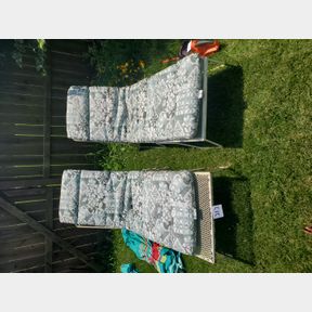 Pair of vintage heavy wrought iron lounders, pads