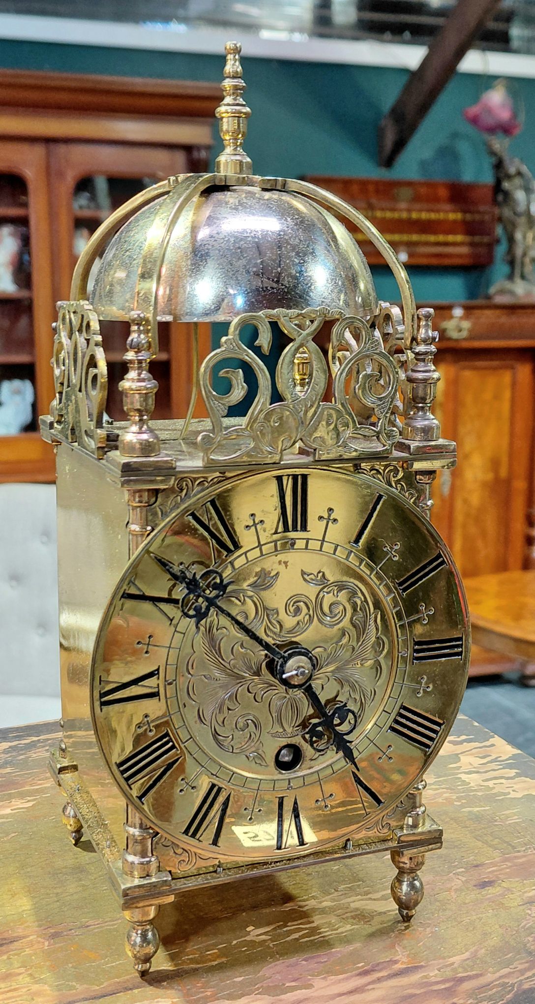 580 · A BRASS LANTERN CLOCK