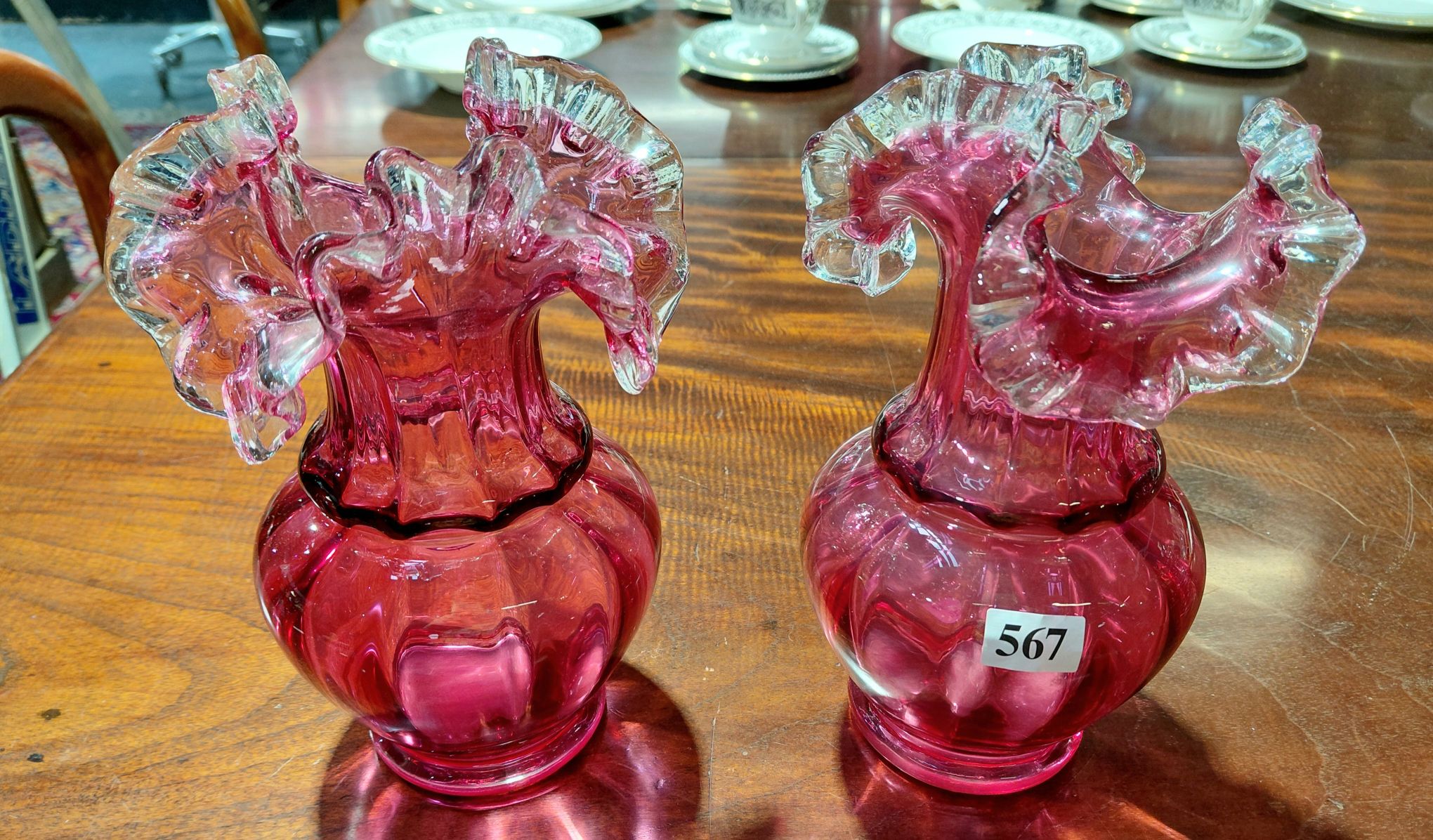 567 · A PAIR OF RUBY GLASS VASES