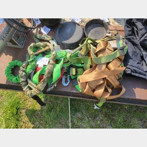 Large assortment of climbing and safety harnesses