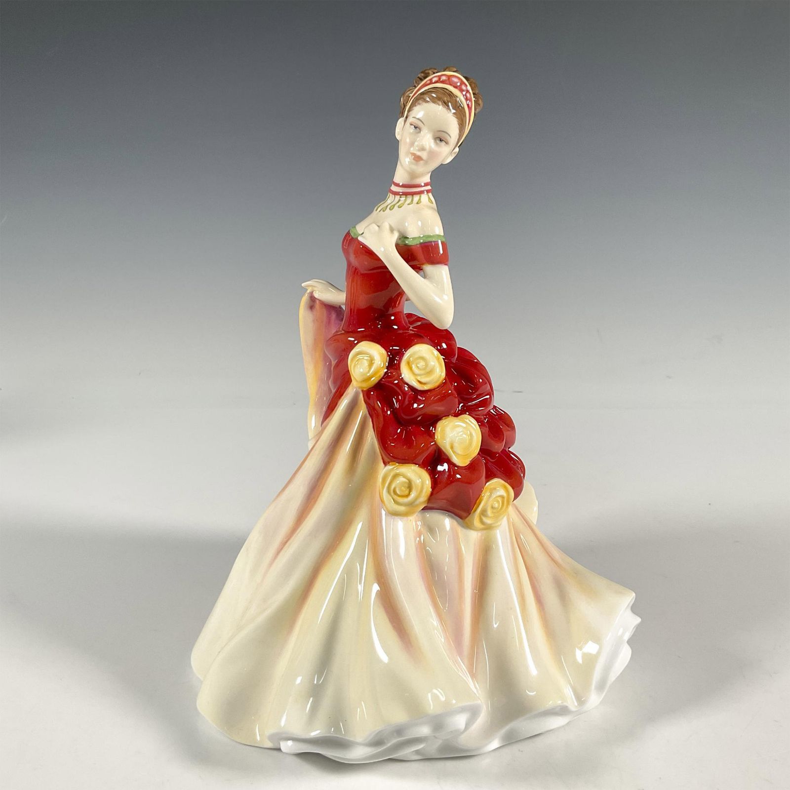 royal doulton figurines red dress Pretty Ladies Sophie Figurine Often characterised by the toe peeping out from a swirling dress Seasons Series Autumn Ball HN5465