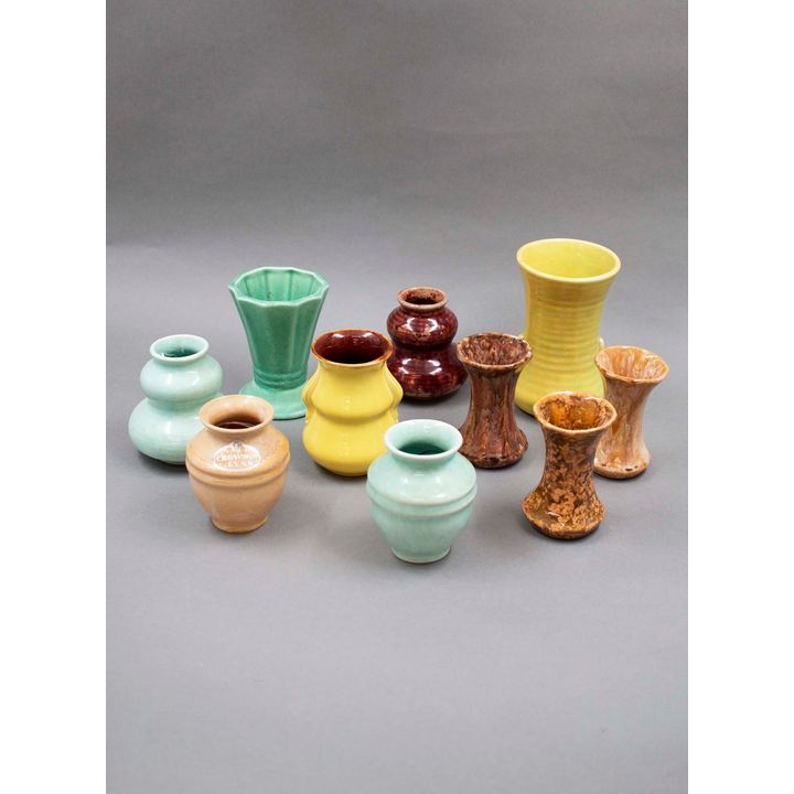 Crown Lynn Potteries - A collection of ten small colour-glazed vases