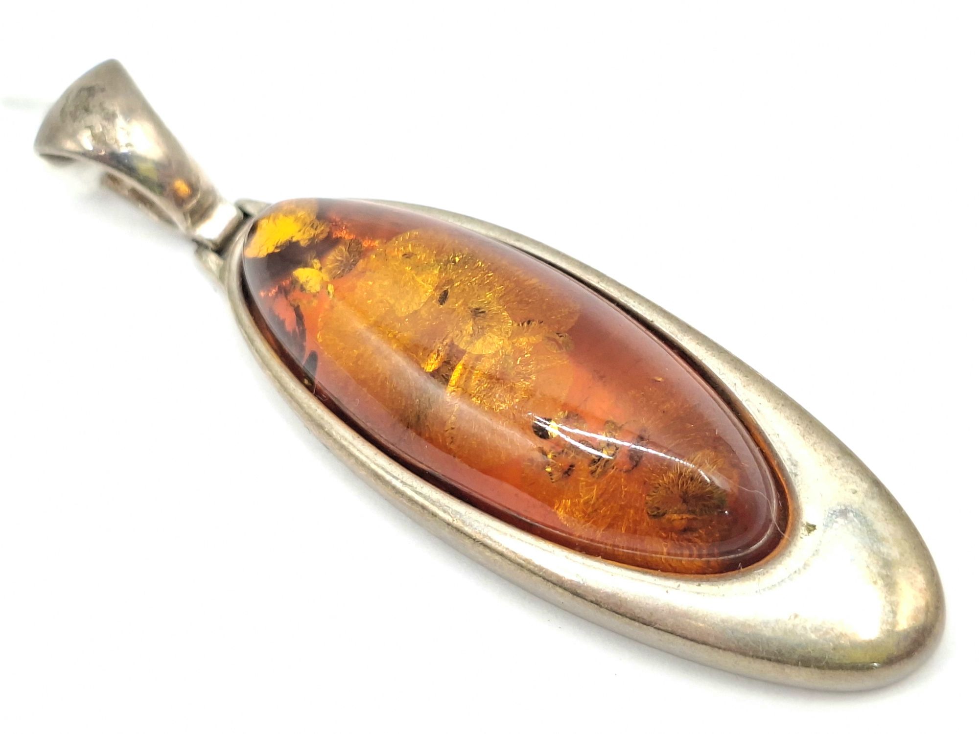 1061 · STERLING SILVER AMBER PENDANT