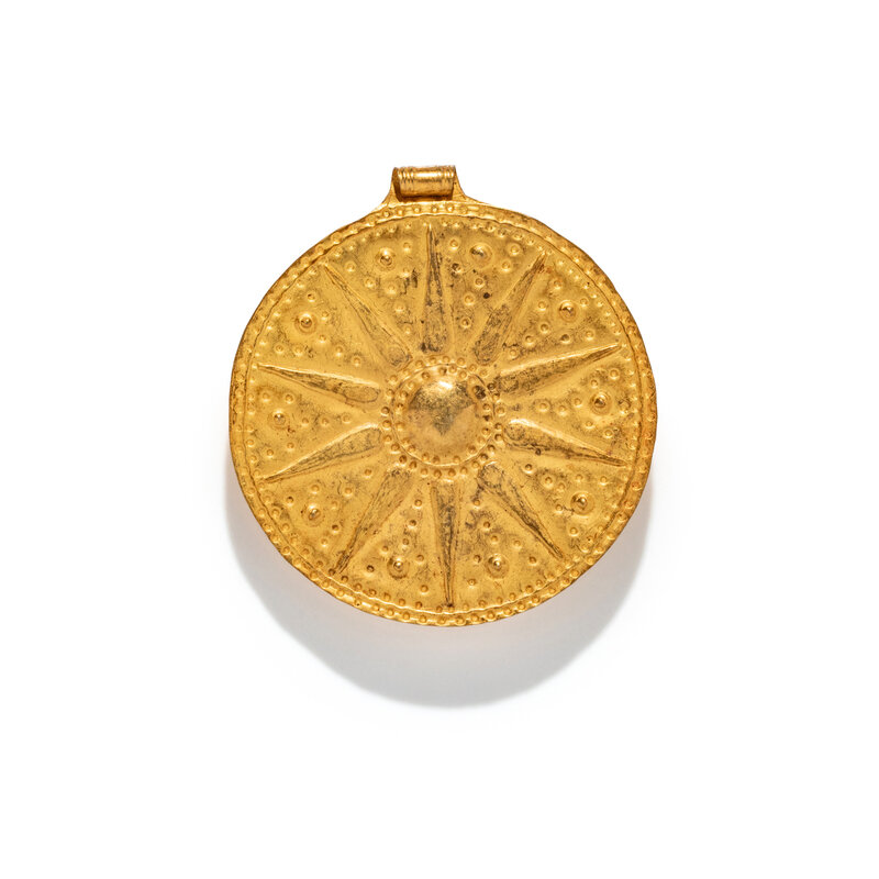 A Near Eastern Gold Disk Pendant