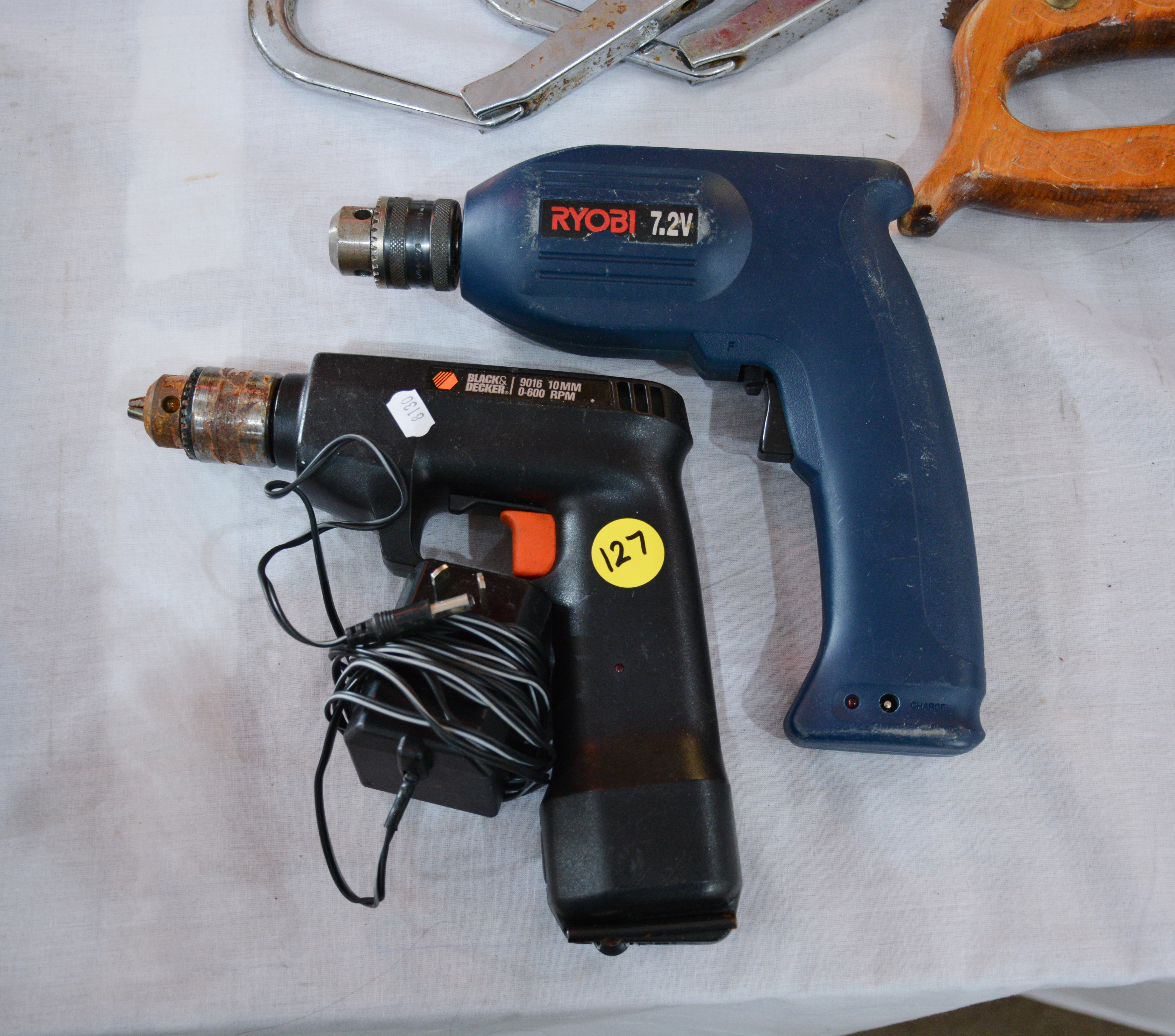 Ryobi and Black + Decker Drills plus Charger — sold at auction in New Zealand for $10