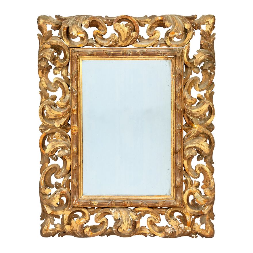 An 18th century Italian Florentine style giltwood carved frame with later mirror plate