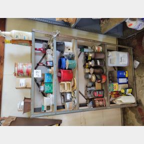 Shelf of misc. shop oils, staples, wire and misc.