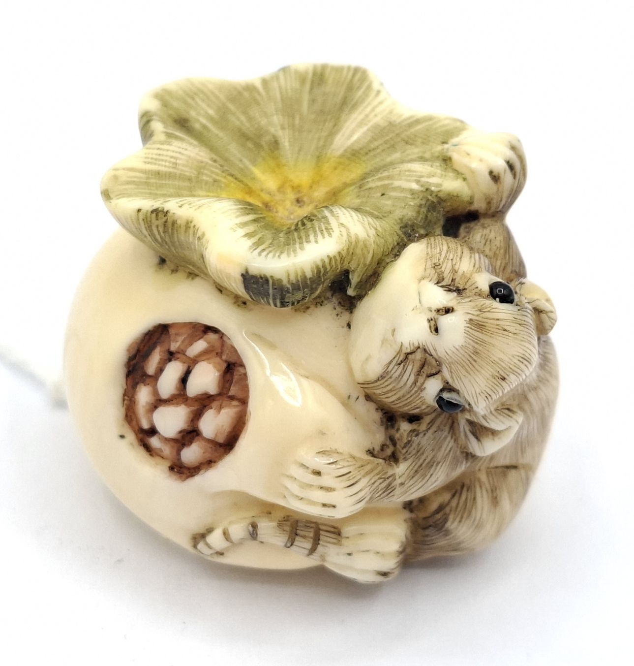 98 · JAPANESE CARVED IVORY NETSUKE