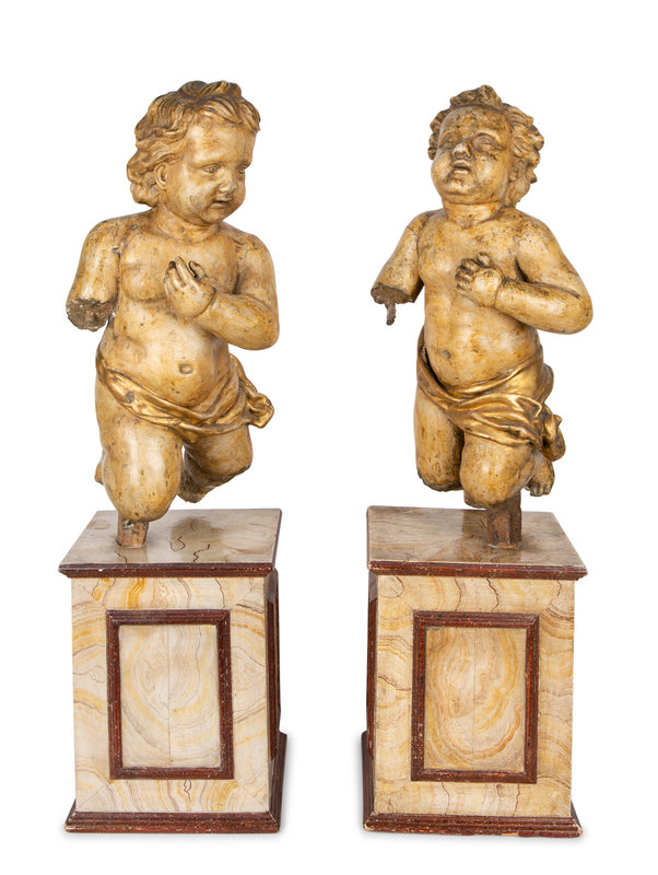 A Pair of Italian Carved and Parcel Gilt Cherubs
Height 34 inches with base.
