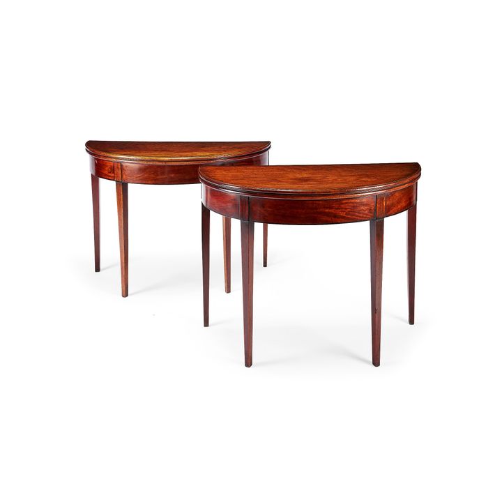 A pair of George III mahogany demi-lune tea tables
