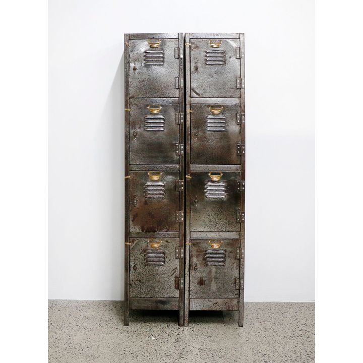 A pair of industrial vertical filing cabinets