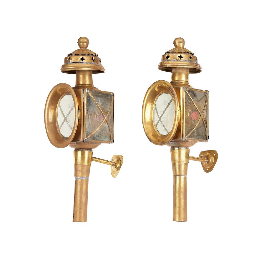 A pair of late 19th century brass carriage lamps