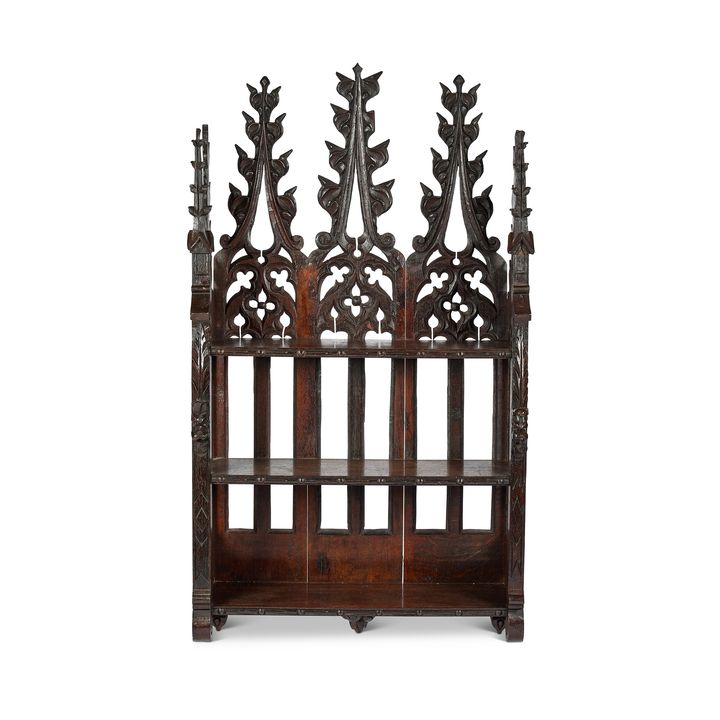 An unusual set of Victorian Gothic oak carved three-tier hanging shelves