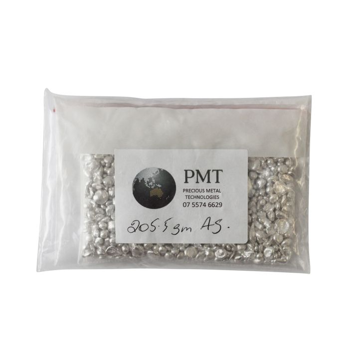 Bag containing 205.5g of pure silver pellets processed by PMT., UNC