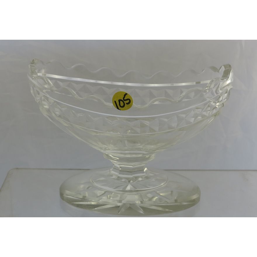 A VICTORIAN CUT CRYSTAL BOAT-SHAPED PEDESTAL BOWL.