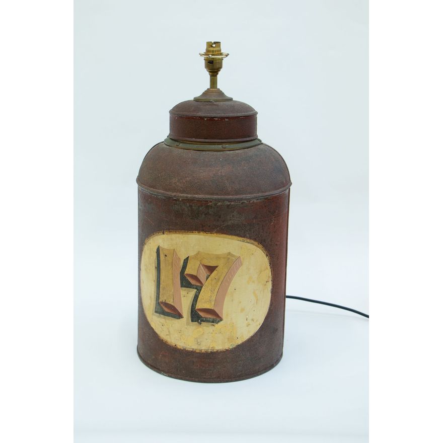 A 19th-century English brown tole-painted tea can