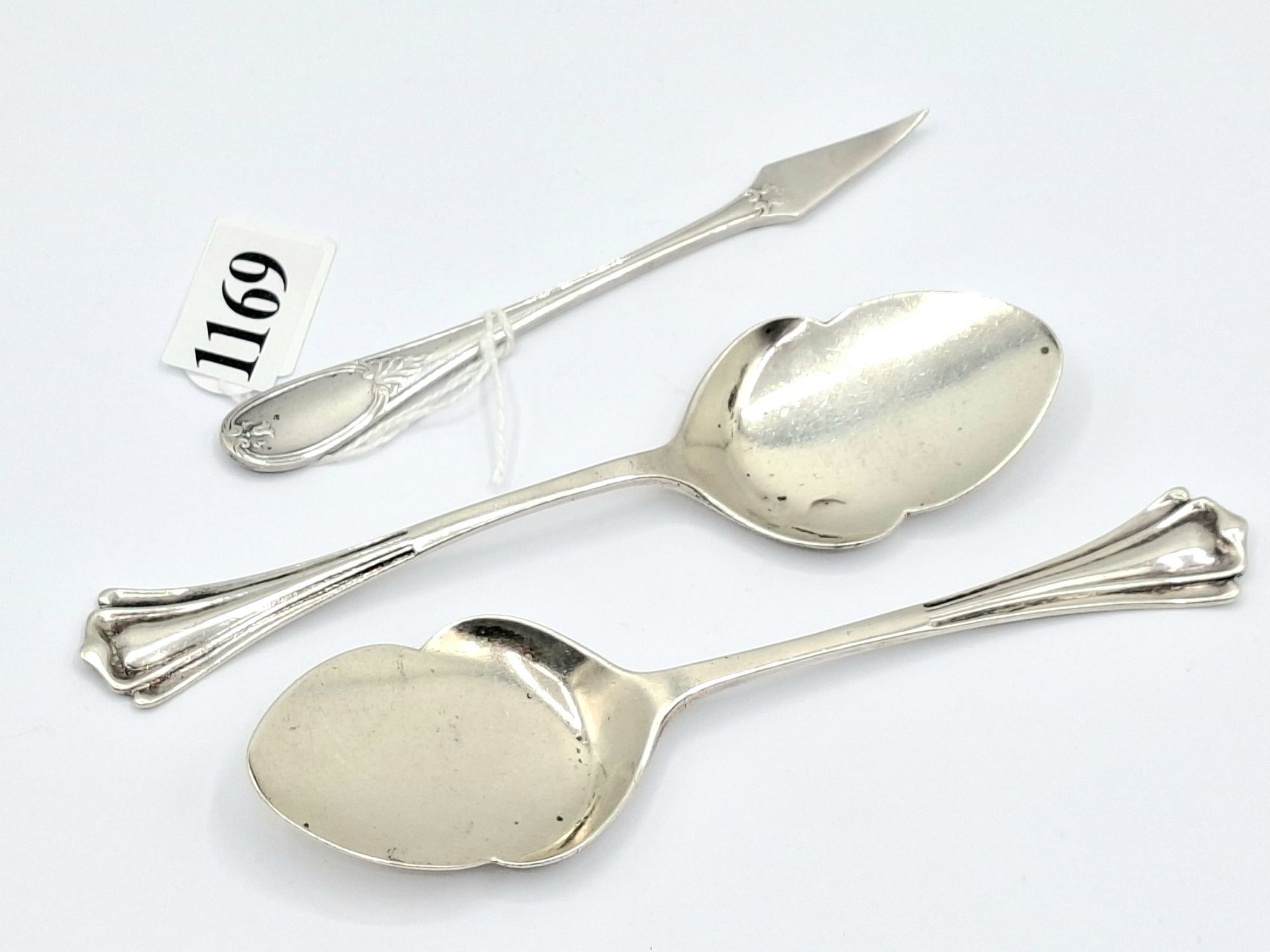 A PAIR OF STERLING SILVER SERVING SPOONS